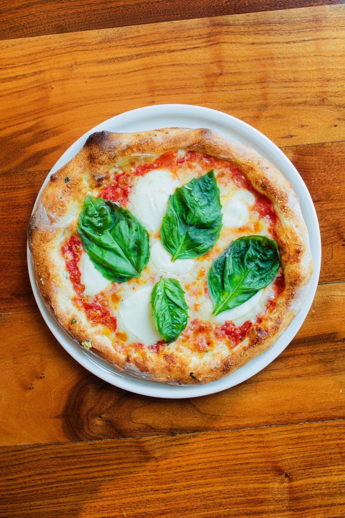 Russo's handcrafted Margherita pizza with fresh basil