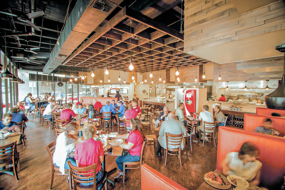 Families dining inside a Russo's New York Pizzeria & Italian Kitchen